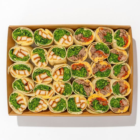 Lunch wraps arranged in a catering box